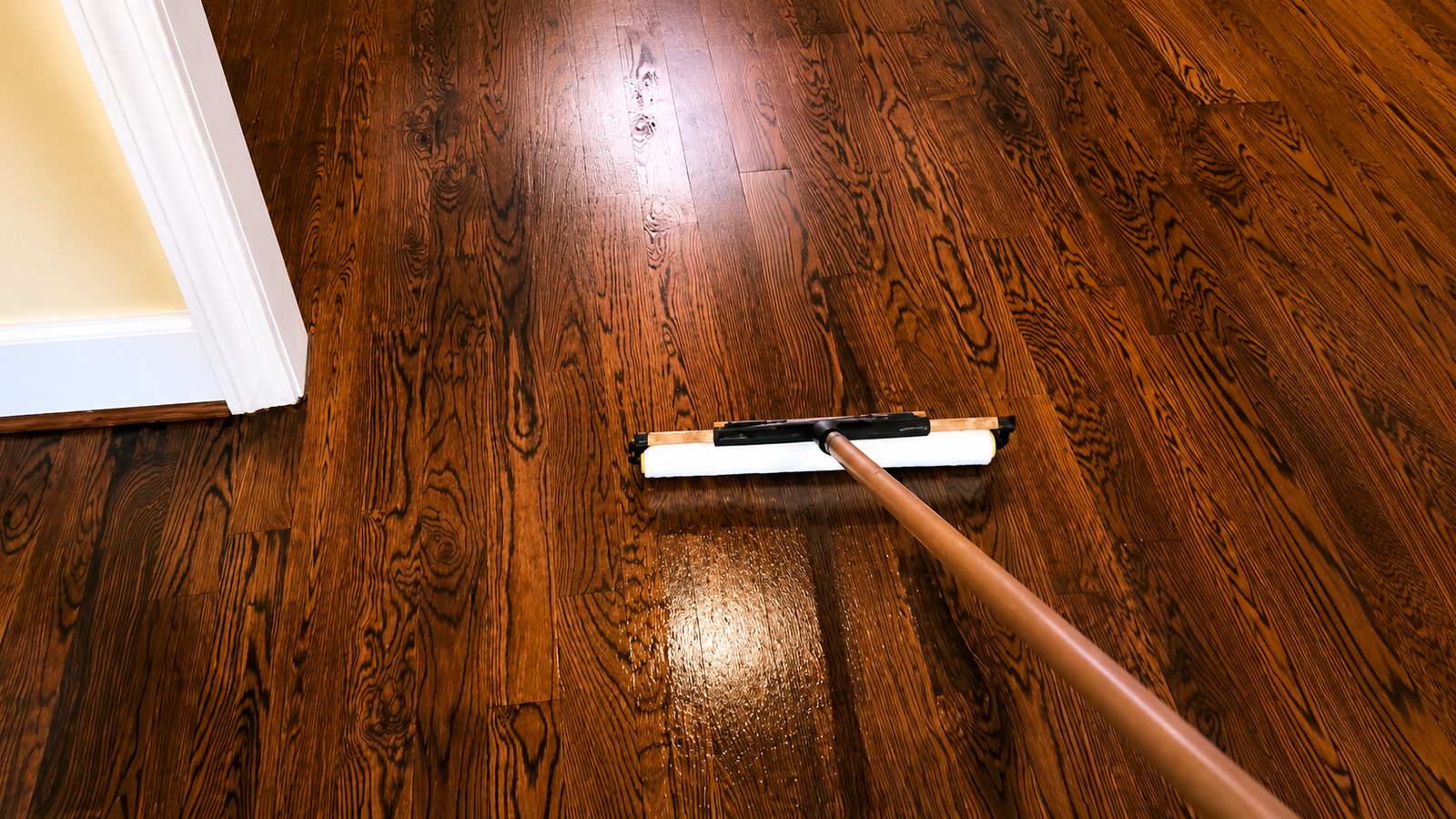 Fresh protective finish being applied to hardwood flooring in Apex North Carolina