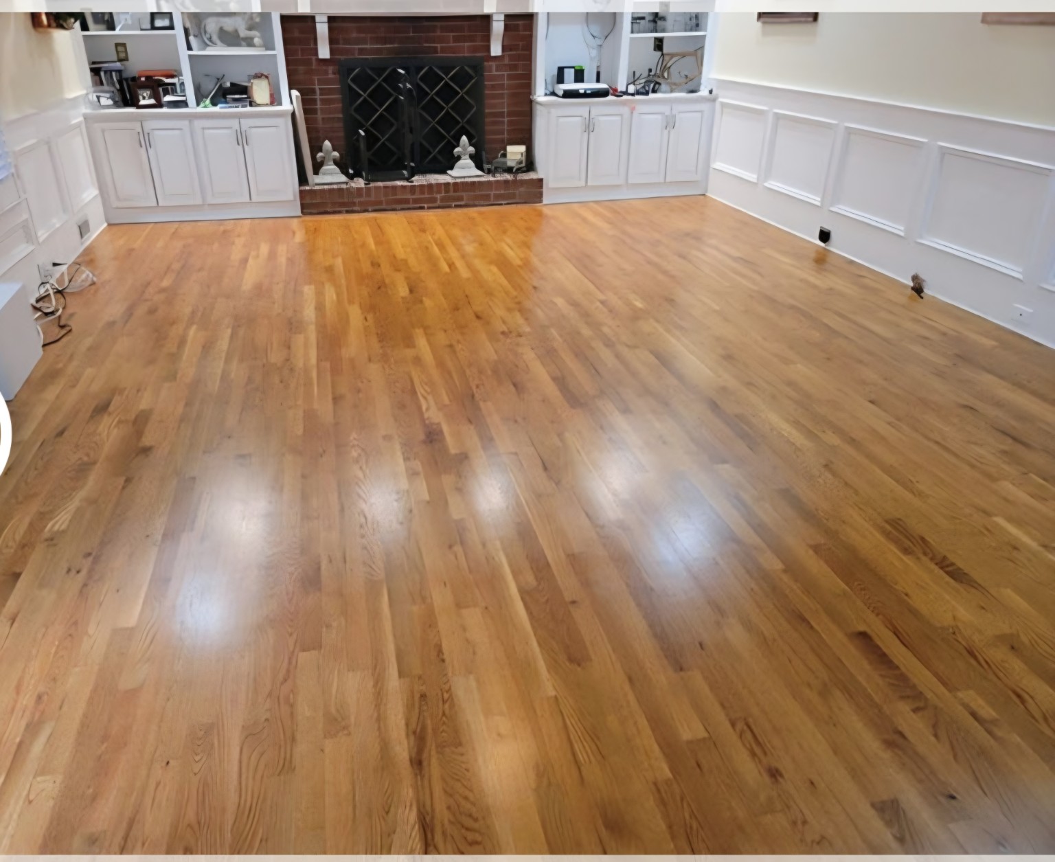 After — Fireplace room hardwood restoration